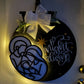 Decorative sign with nativity scene and 'O Night Divine'.